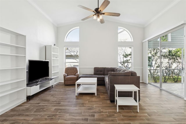 living room featuring ceiling fan, ornamental molding, and high vaulted ceiling