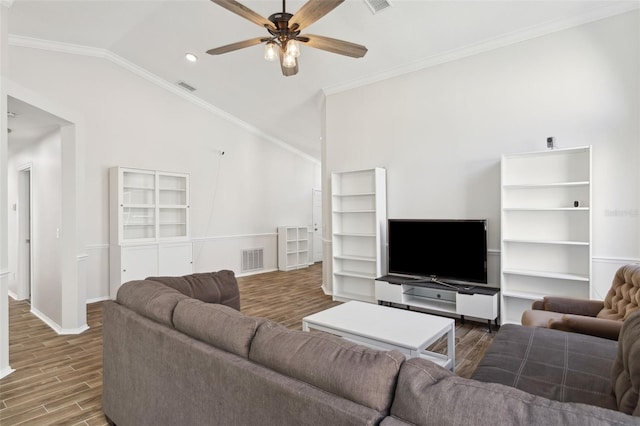 living room with crown molding, ceiling fan, lofted ceiling, and dark hardwood / wood-style flooring