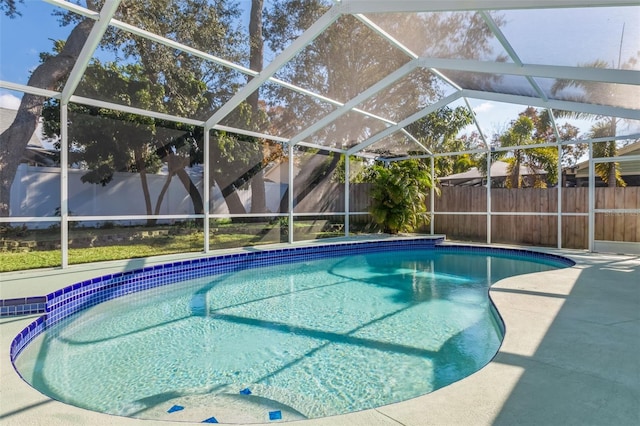 view of pool featuring a patio and glass enclosure