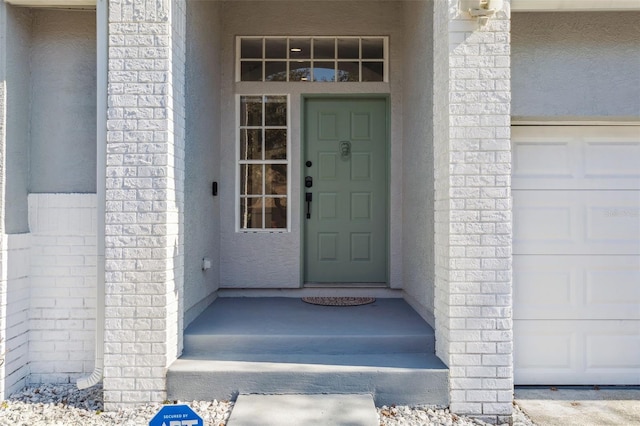 property entrance with a garage