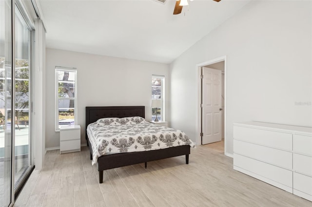 bedroom featuring vaulted ceiling, access to exterior, ceiling fan, and light hardwood / wood-style floors