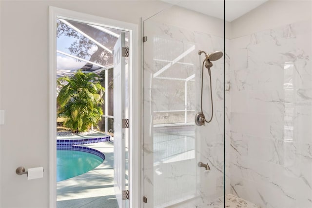 bathroom with tiled shower