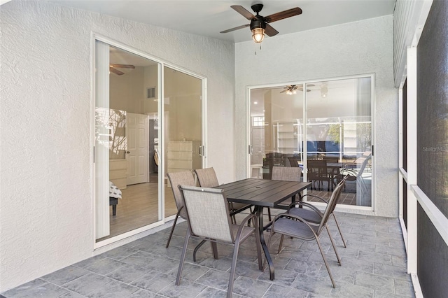 sunroom / solarium with ceiling fan