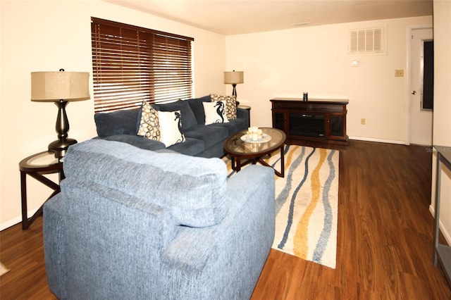 living room featuring dark wood-type flooring