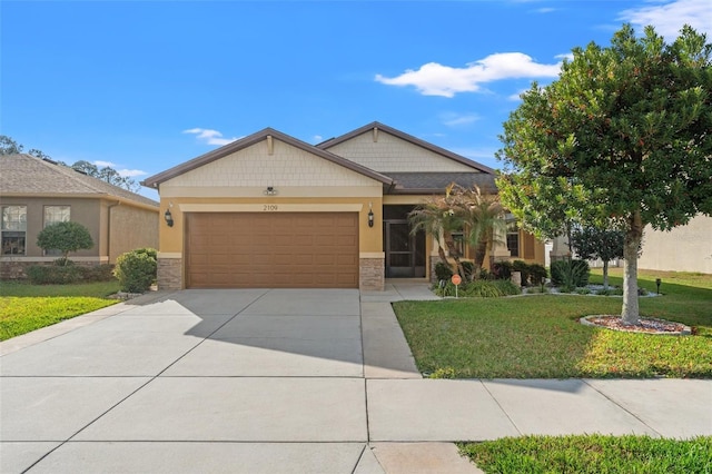 craftsman inspired home with a garage, driveway, stone siding, stucco siding, and a front yard