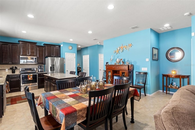 dining area featuring light tile patterned flooring, baseboards, visible vents, and recessed lighting