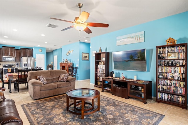 living room with a ceiling fan, recessed lighting, visible vents, and light tile patterned flooring