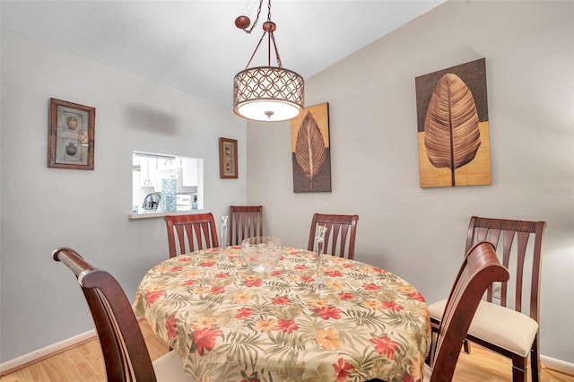 dining space featuring light wood-type flooring