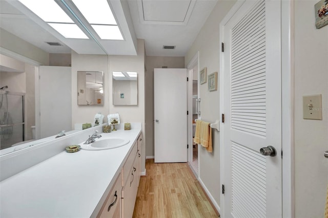 bathroom featuring vanity and hardwood / wood-style floors