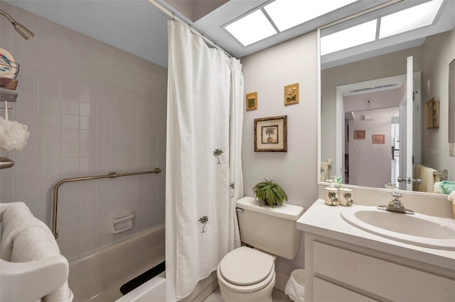 full bathroom with vanity, toilet, a skylight, and shower / tub combo