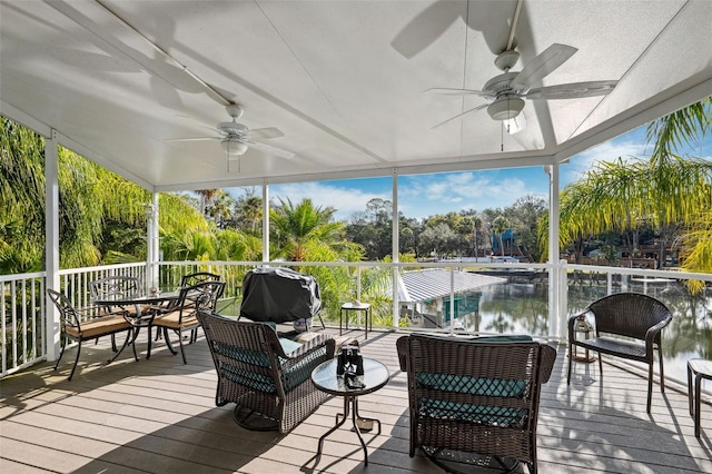 sunroom featuring ceiling fan