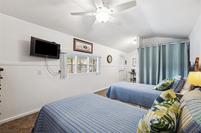 tiled bedroom featuring vaulted ceiling and ceiling fan