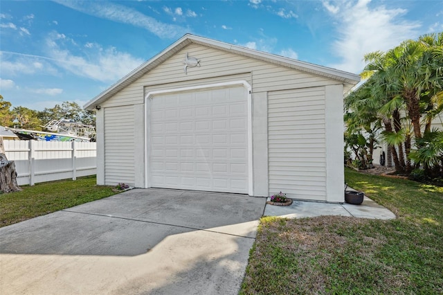 garage featuring a lawn