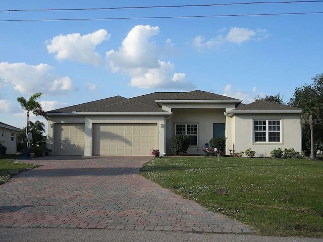 view of front of property featuring a garage and a front yard