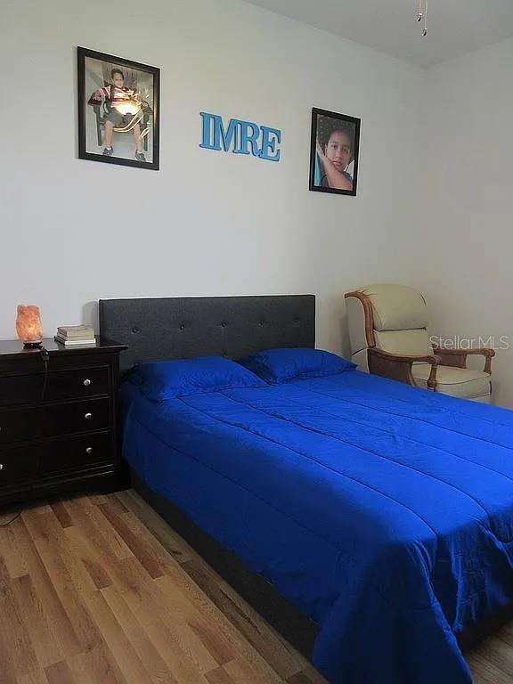 bedroom featuring hardwood / wood-style flooring