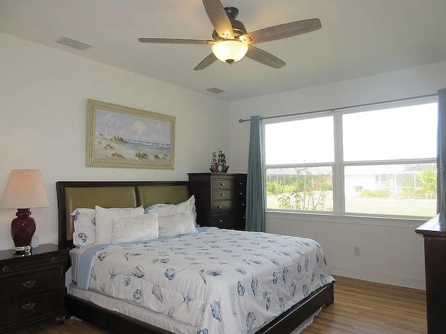 bedroom with hardwood / wood-style flooring and ceiling fan