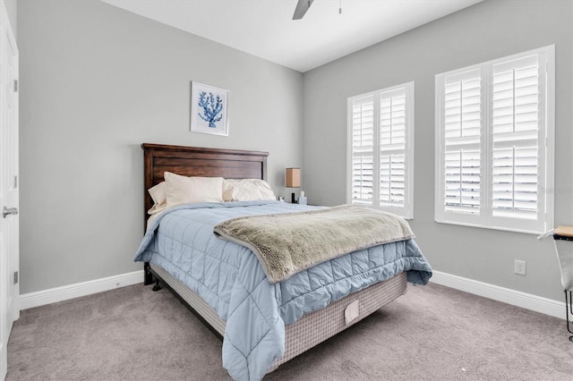 bedroom featuring light carpet and ceiling fan