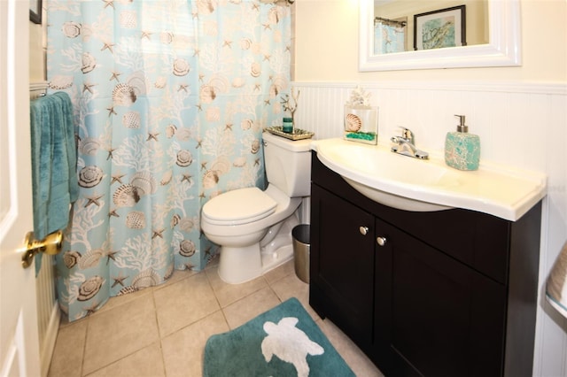 bathroom with vanity, tile patterned floors, and toilet