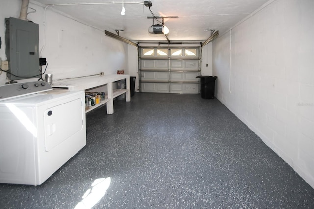 garage featuring a garage door opener, washer / dryer, and electric panel