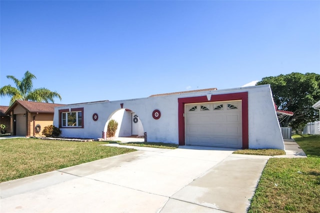 view of front facade featuring a garage, a front lawn, and central air condition unit