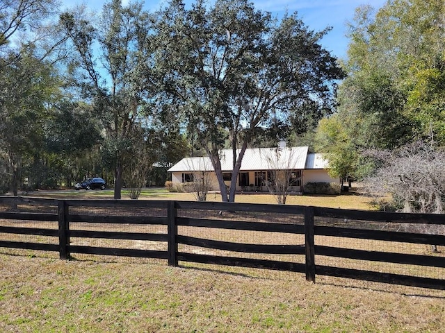 view of gate featuring a lawn