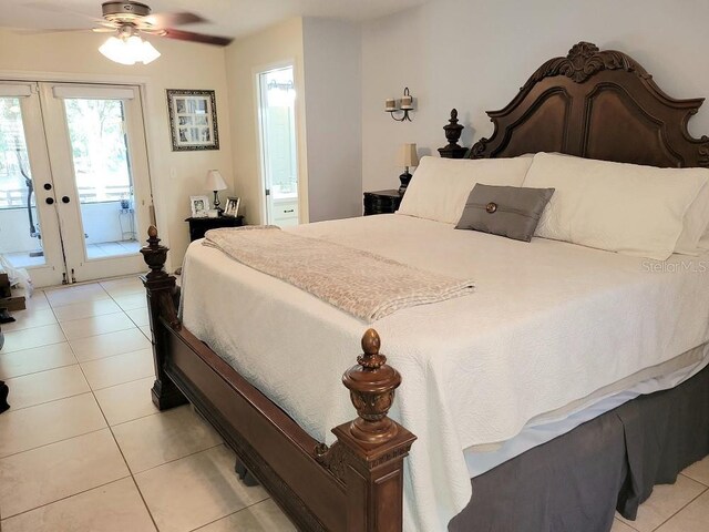 tiled bedroom with access to outside, french doors, and ensuite bathroom
