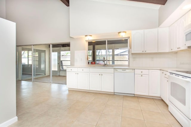 kitchen featuring sink, white cabinetry, tasteful backsplash, white appliances, and beam ceiling