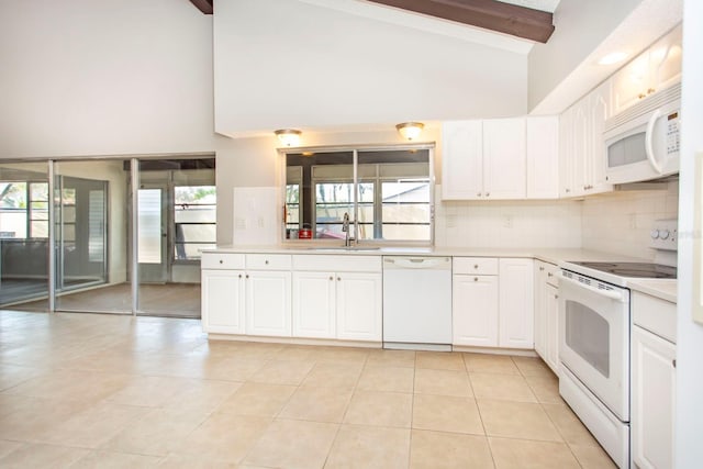 kitchen featuring sink, white cabinetry, white appliances, beam ceiling, and decorative backsplash