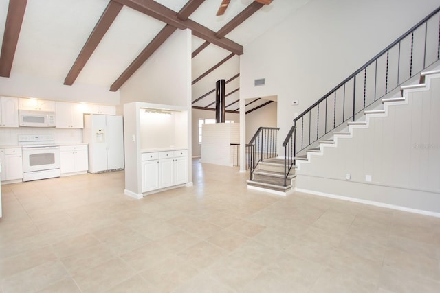 unfurnished living room with beamed ceiling and high vaulted ceiling