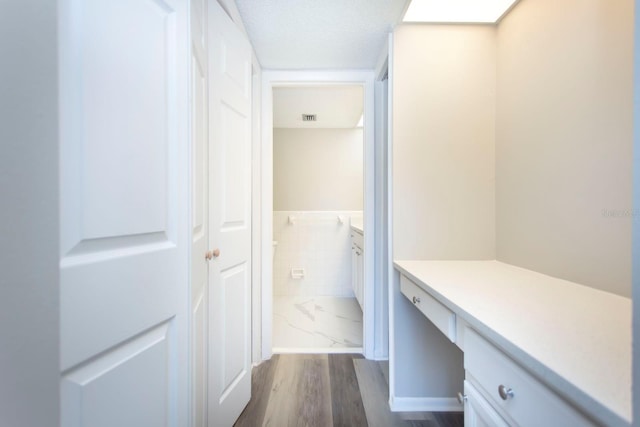 hall with dark hardwood / wood-style flooring