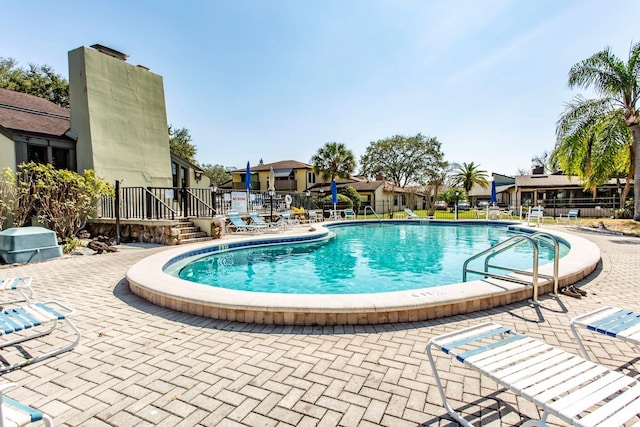 view of swimming pool featuring a patio area