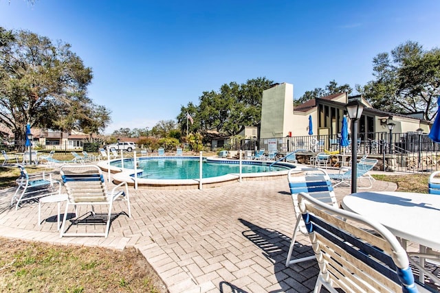 view of swimming pool with a patio