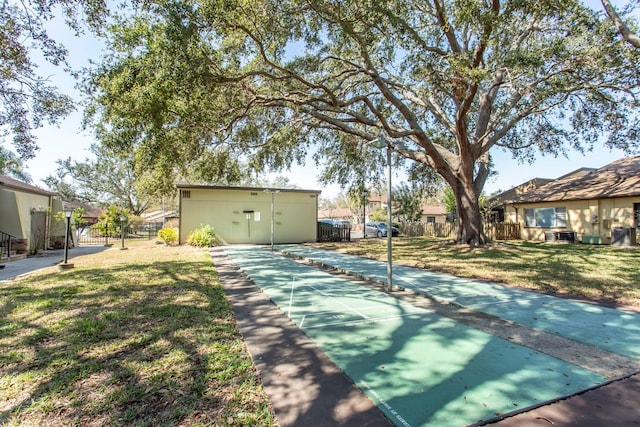 view of home's community featuring a lawn