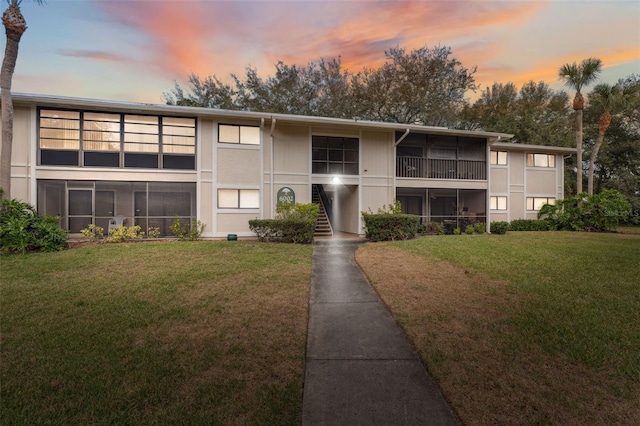 view of outdoor building at dusk