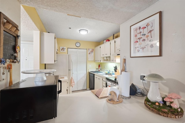 kitchen with dishwasher, white cabinetry, sink, and a textured ceiling