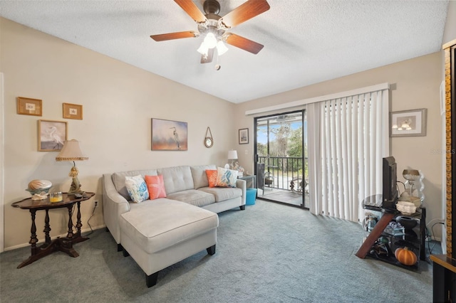 living room featuring ceiling fan, a textured ceiling, and carpet flooring