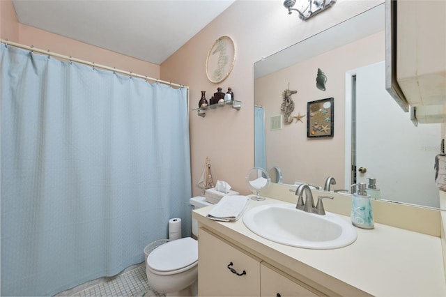 bathroom featuring vanity, toilet, and tile patterned flooring