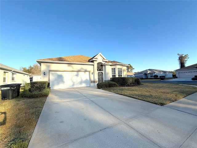 ranch-style house with a garage and a front yard