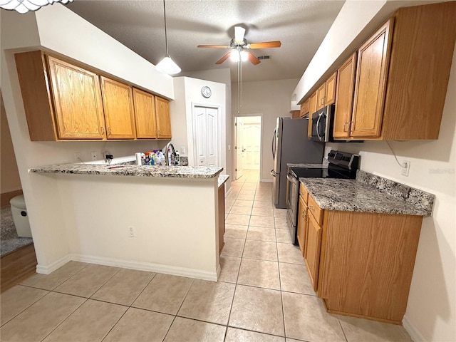 kitchen featuring light tile patterned flooring, ceiling fan, kitchen peninsula, light stone countertops, and electric stove