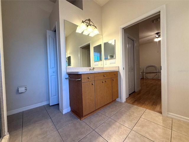 bathroom featuring tile patterned flooring, vanity, and ceiling fan