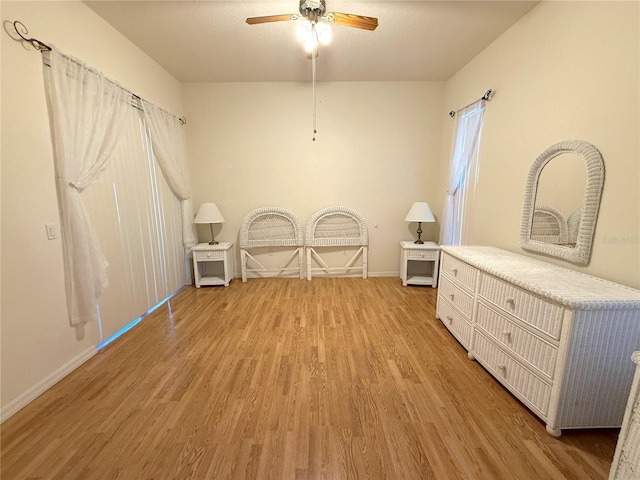 miscellaneous room with ceiling fan and light hardwood / wood-style flooring