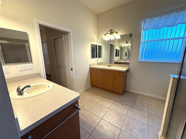 bathroom with tile patterned floors and vanity