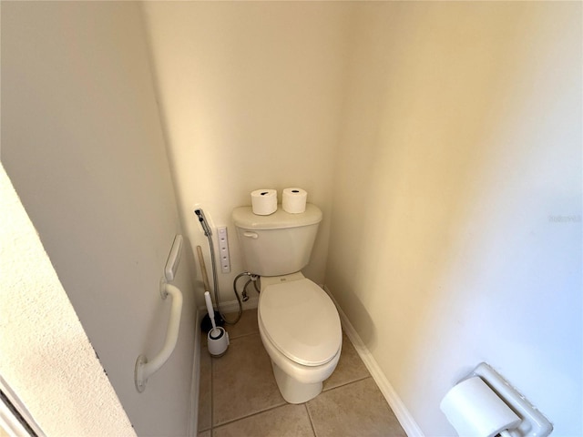 bathroom featuring tile patterned floors and toilet