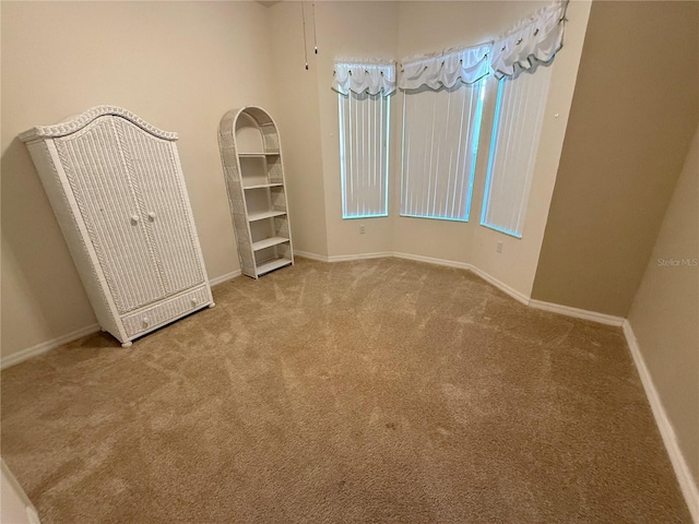 unfurnished bedroom with light colored carpet