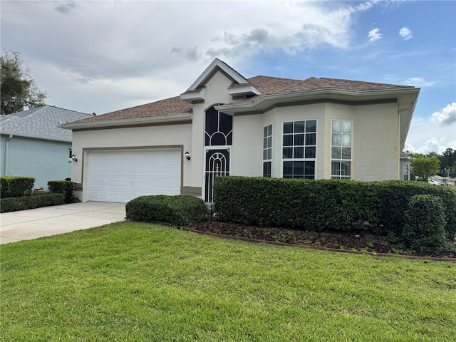 11204 Clear Oak Cir, New Port Richey, FL 34654 - ranch-style house with driveway, an attached garage, stucco siding, and a front yard