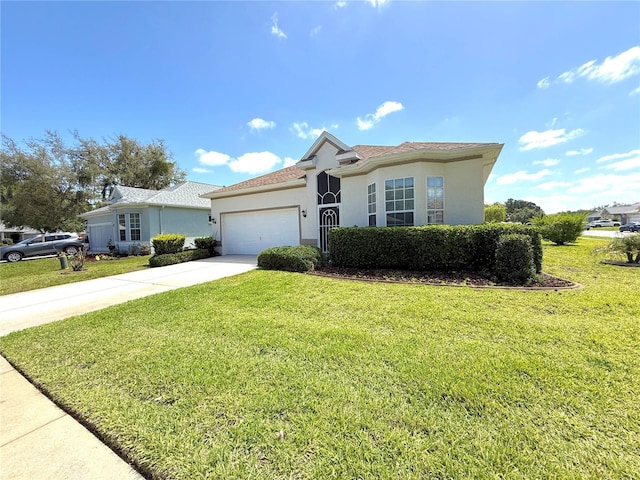 11204 Clear Oak Cir, New Port Richey, FL 34654 - ranch-style home featuring stucco siding, an attached garage, driveway, and a front lawn