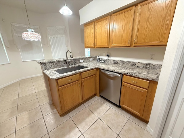 11204 Clear Oak Cir, New Port Richey, FL 34654 - kitchen featuring dishwasher, a sink, a peninsula, light tile patterned floors, and brown cabinets