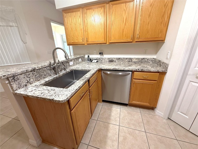 11204 Clear Oak Cir, New Port Richey, FL 34654 - kitchen with dishwasher, a sink, light tile patterned floors, and light stone countertops