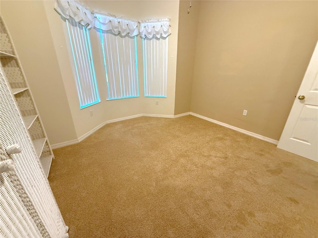 11204 Clear Oak Cir, New Port Richey, FL 34654 - carpeted spare room featuring baseboards