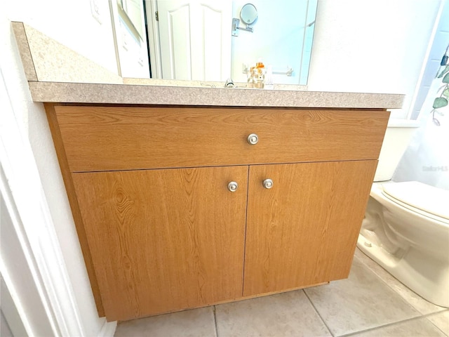 11204 Clear Oak Cir, New Port Richey, FL 34654 - bathroom with vanity, tile patterned flooring, and toilet